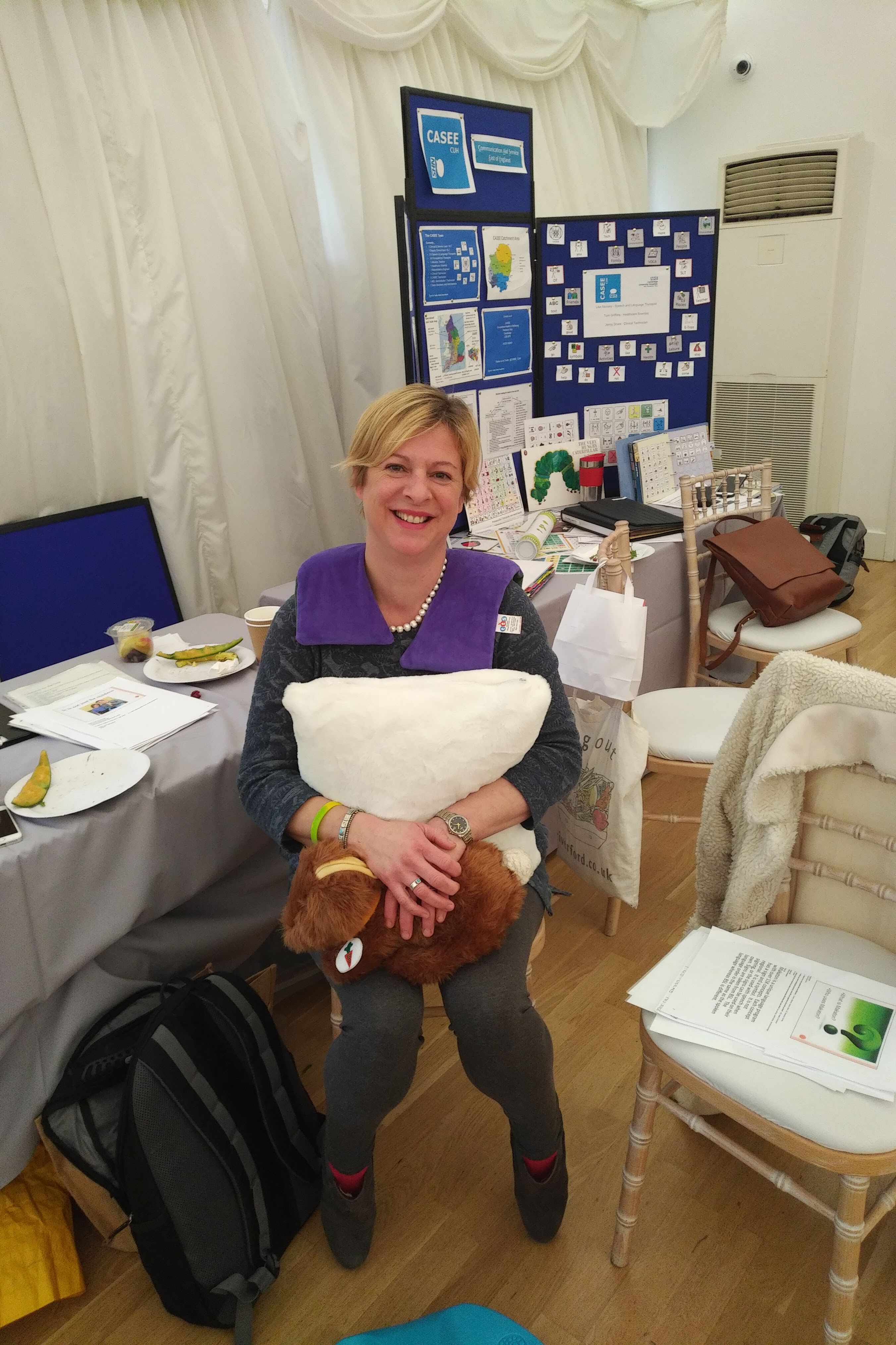 A lady hugging a pillow